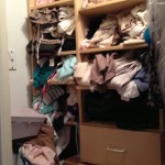 Before-unfolded clothes falling out of shelves